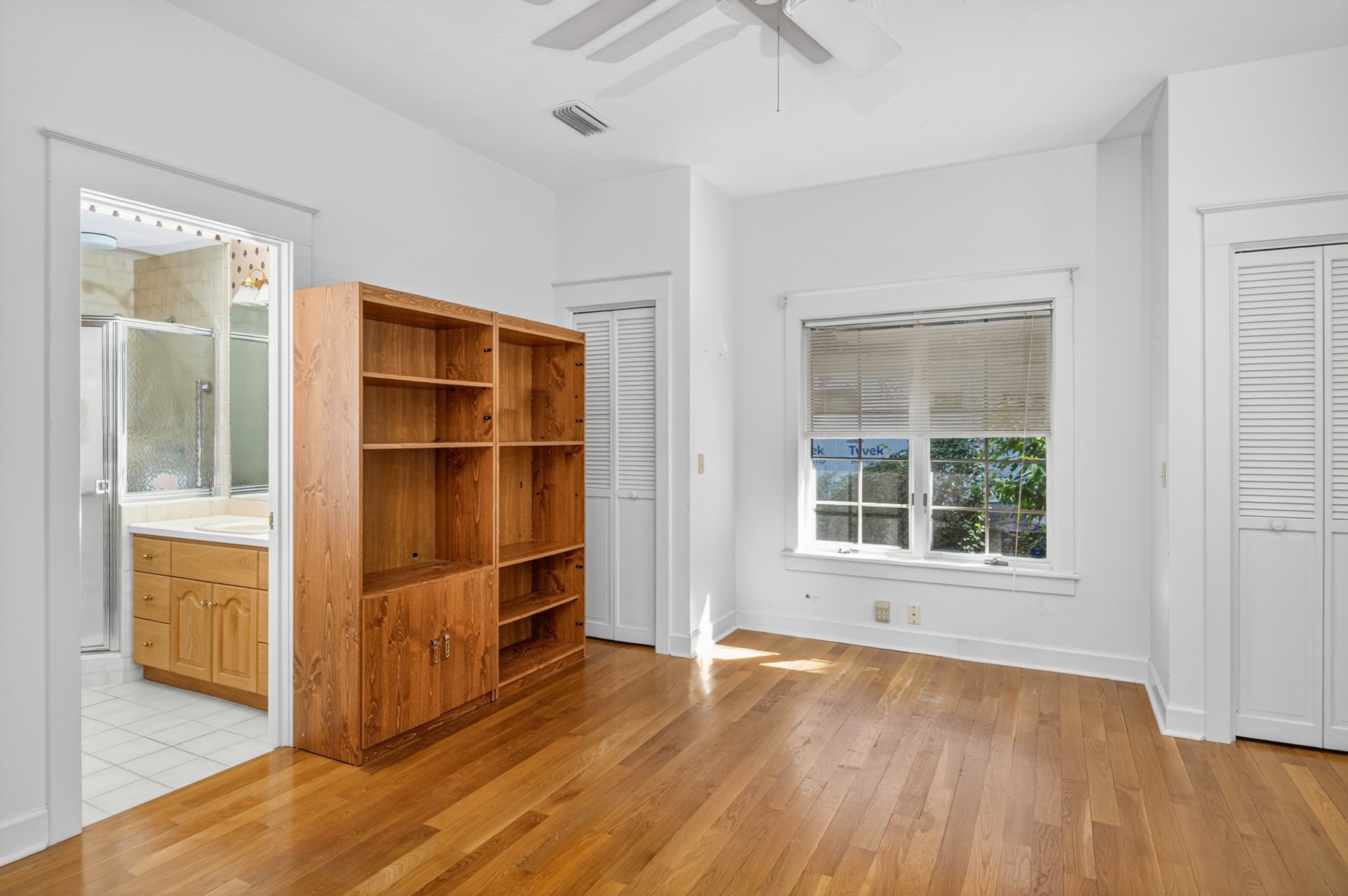 7 Hickory Lane Fernandina Beach, FL 32034 - Photo 25 of 42 an empty room with wooden floor and windows