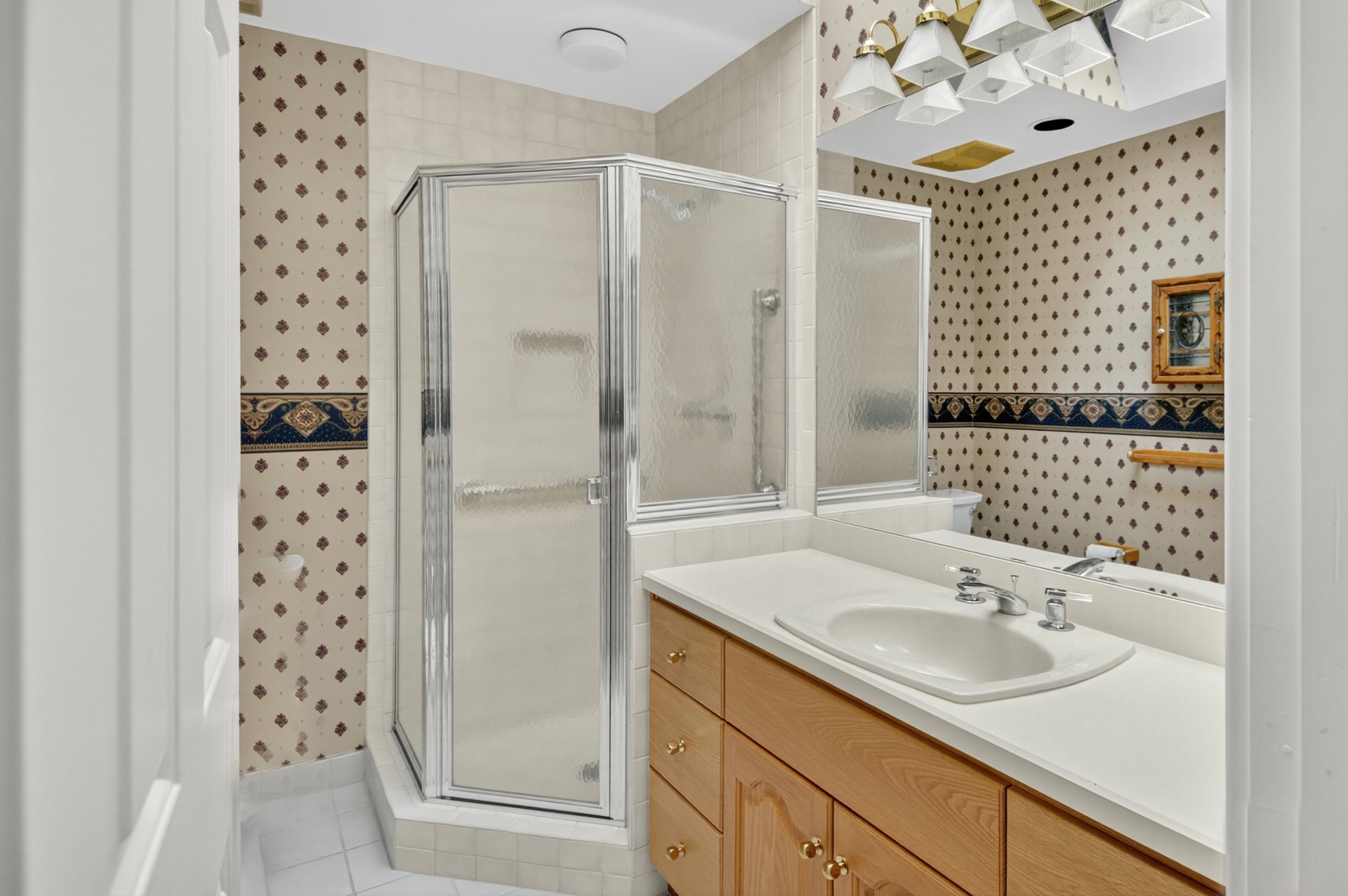 7 Hickory Lane Fernandina Beach, FL 32034 - Photo 27 of 42 a bathroom with a sink and a mirror with shower