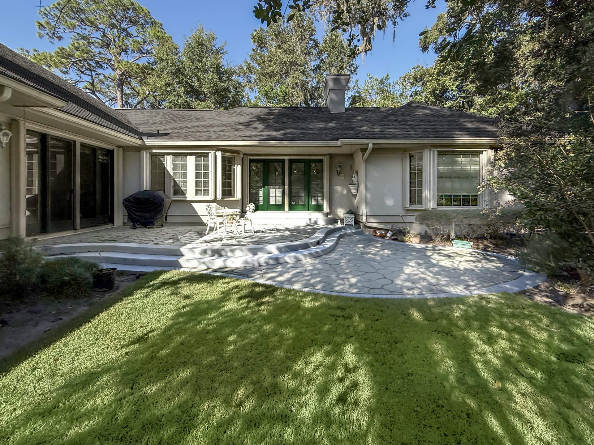 7 Hickory Lane Fernandina Beach, FL 32034 - Photo 34 of 42 a front view of a house with a garden and patio