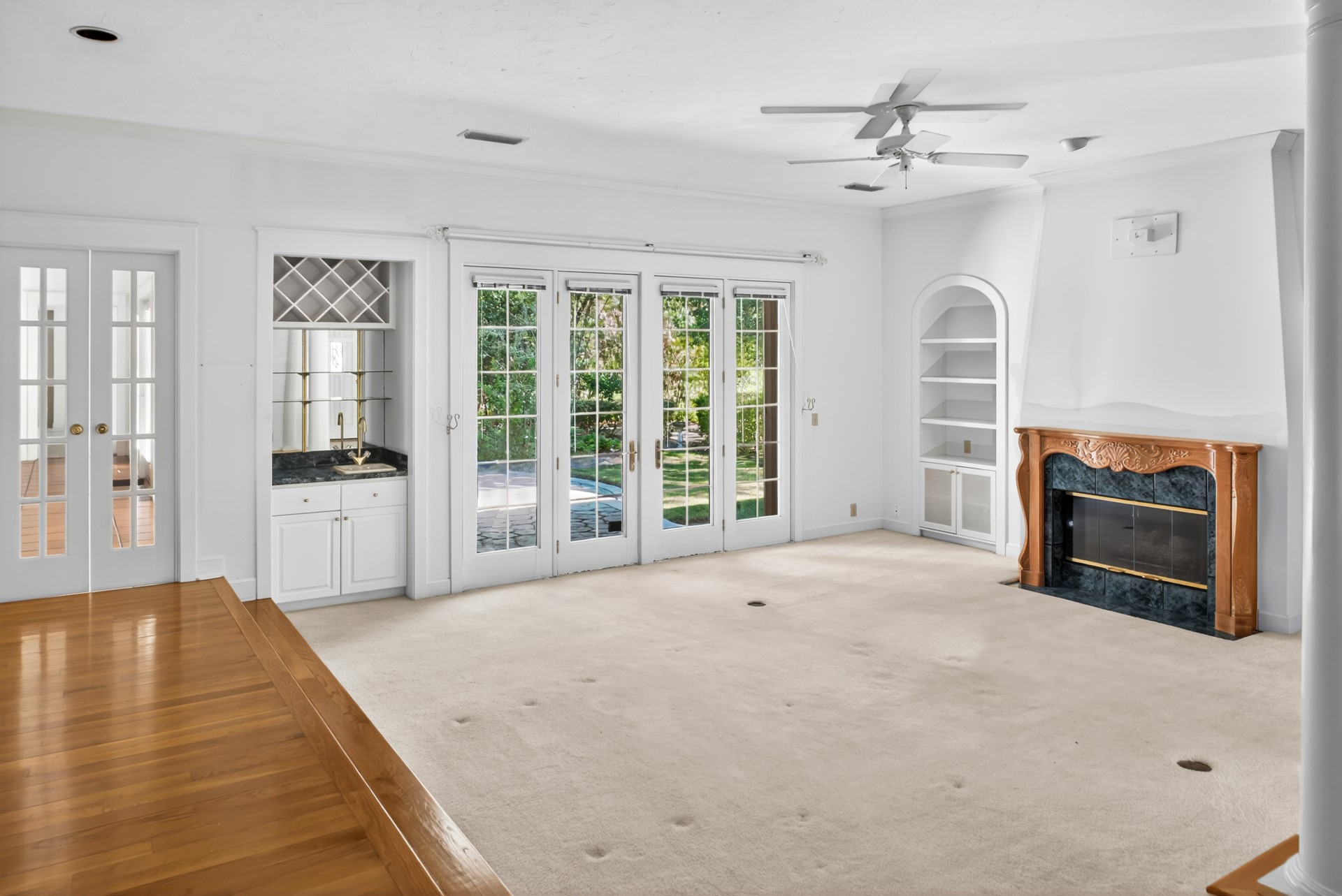 7 Hickory Lane Fernandina Beach, FL 32034 - Photo 5 of 42 a large white bed in a white room with windows