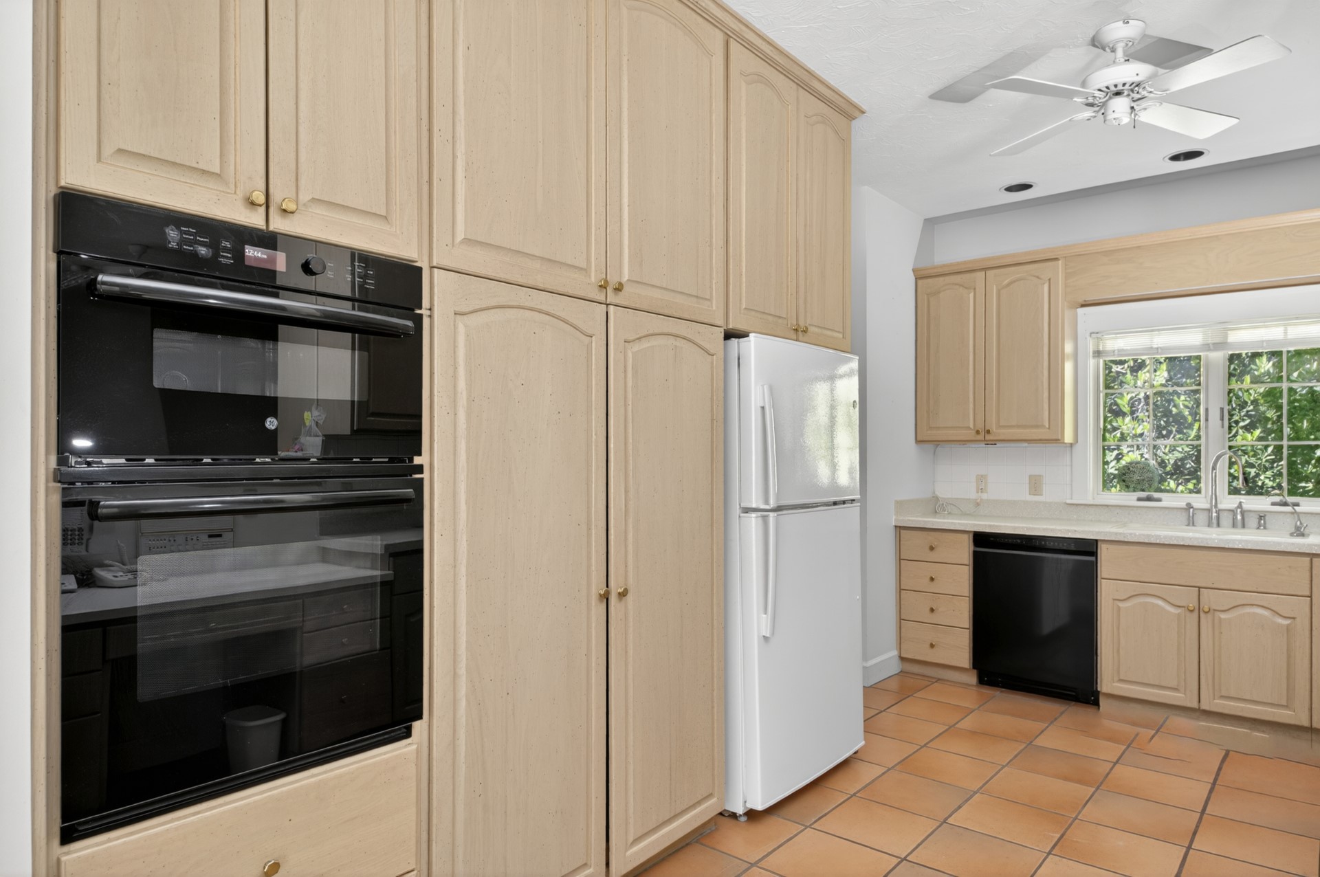 7 Hickory Lane Fernandina Beach, FL 32034 - Photo 10 of 42 a kitchen with granite countertop white cabinets stainless steel appliances and sink