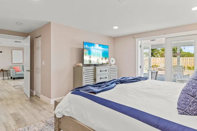 a bedroom with a bed and a dresser