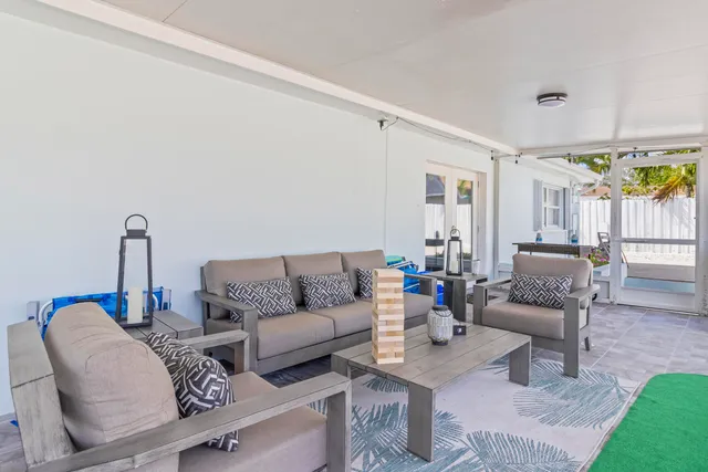 a living room with furniture and a table
