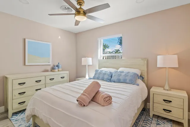 a bedroom with a bed and a dresser