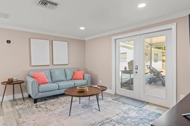 a living room with furniture and a table