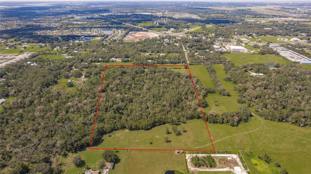 12355 Doris Road Parrish, FL 34219 - Photo 25 of 27 an aerial view of residential houses with outdoor space