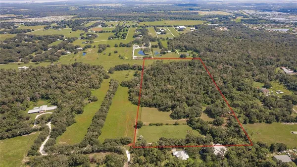 an aerial view of houses with yard