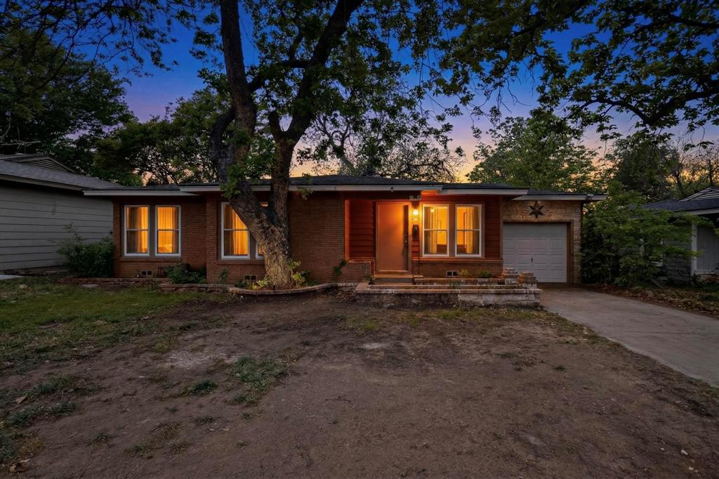 4508 Rutland Avenue Fort Worth, TX 76133 - Photo 2 of 36 a view of a house with backyard and garden