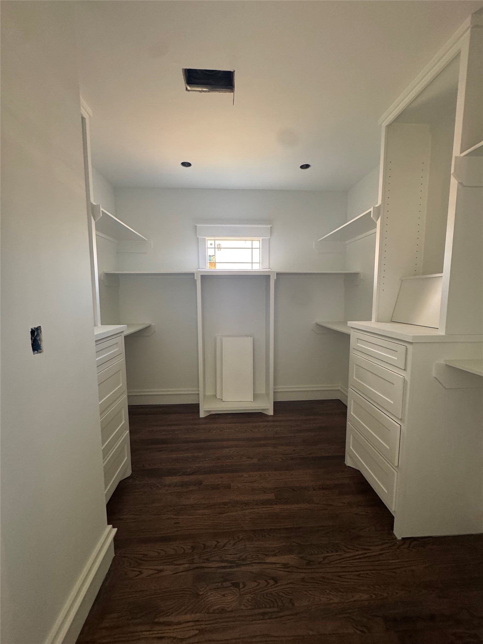 1208 Caplin Street Houston, TX 77022 - Photo 25 of 35 WALK IN CLOSET WITH BUILT IN CABINETRY