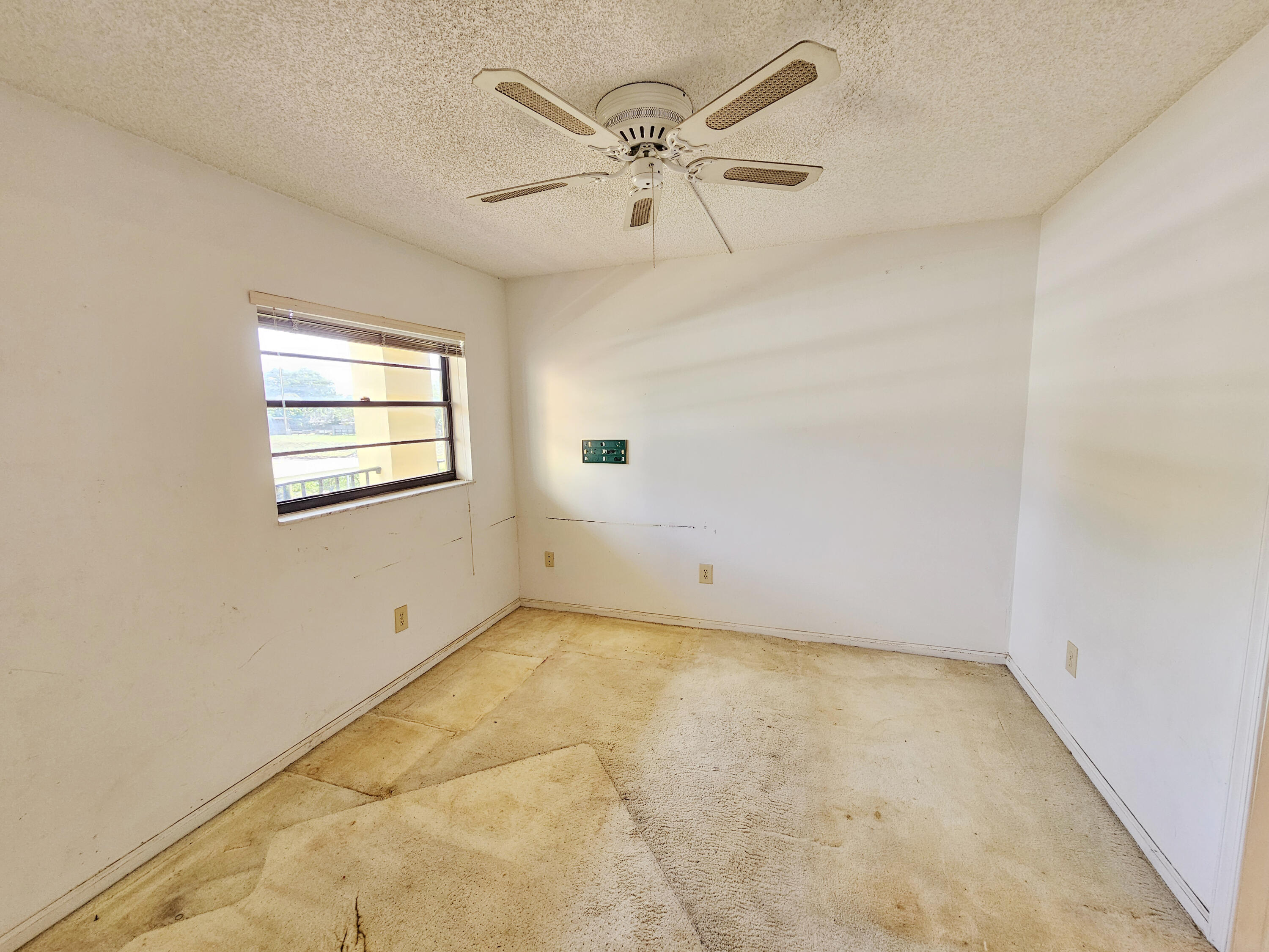 23385 South Barwood Lane, Unit 1203 Boca Raton, FL 33428 - Photo 11 of 22 a view of an empty room with a window