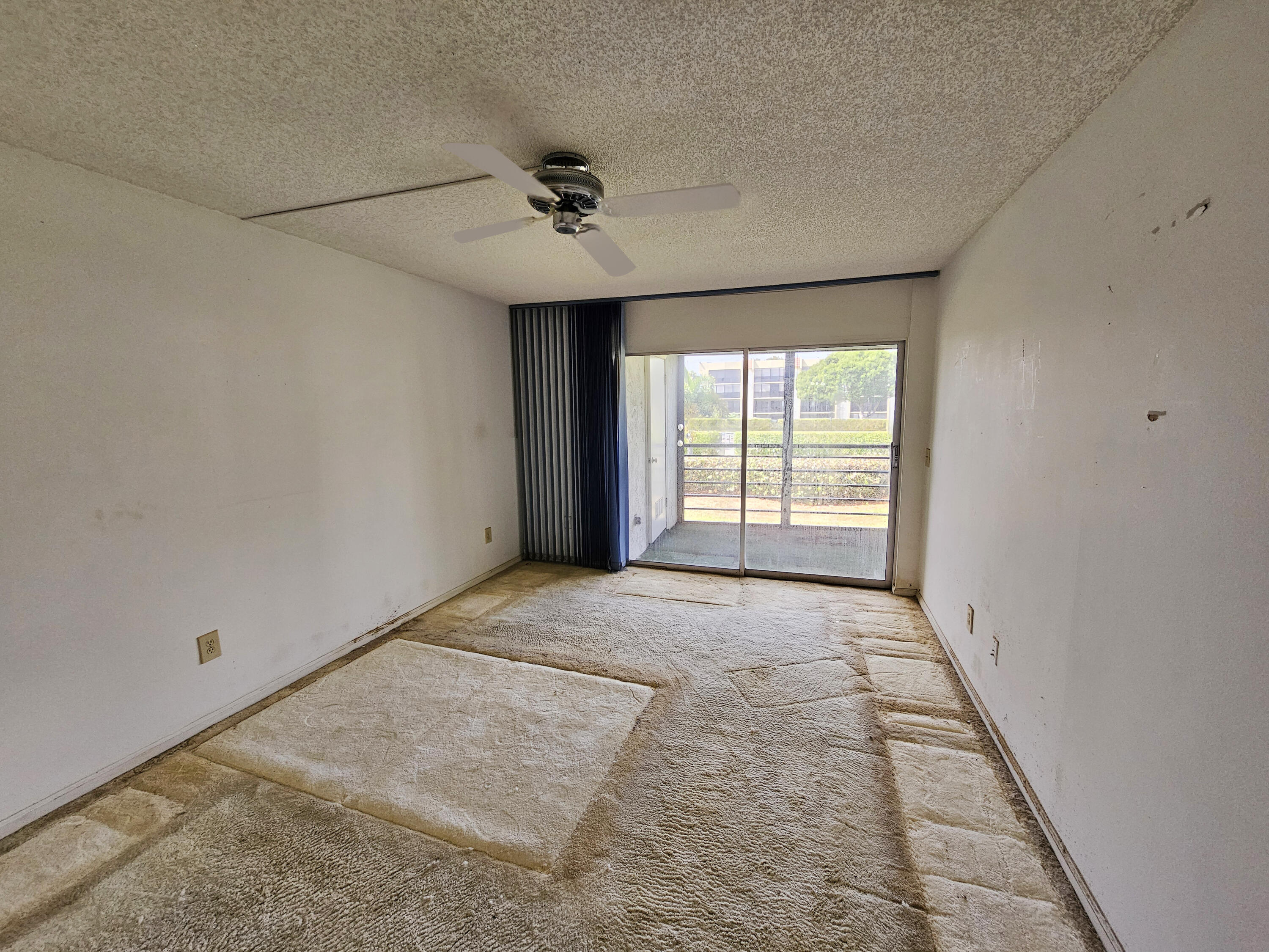 23385 South Barwood Lane, Unit 1203 Boca Raton, FL 33428 - Photo 13 of 22 a view of an empty room with a window