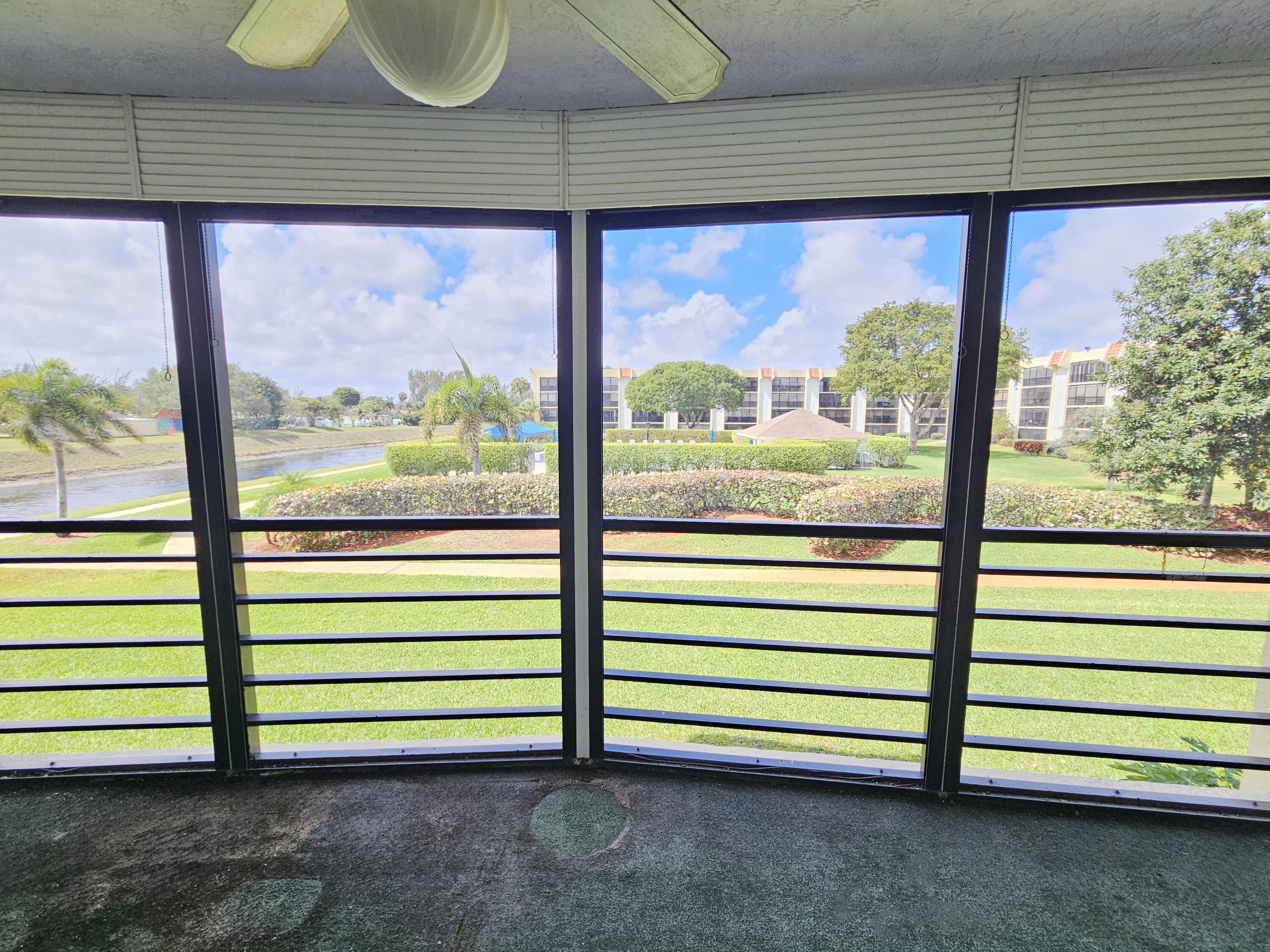 23385 South Barwood Lane, Unit 1203 Boca Raton, FL 33428 - Photo 17 of 22 a view of a bench in front of building