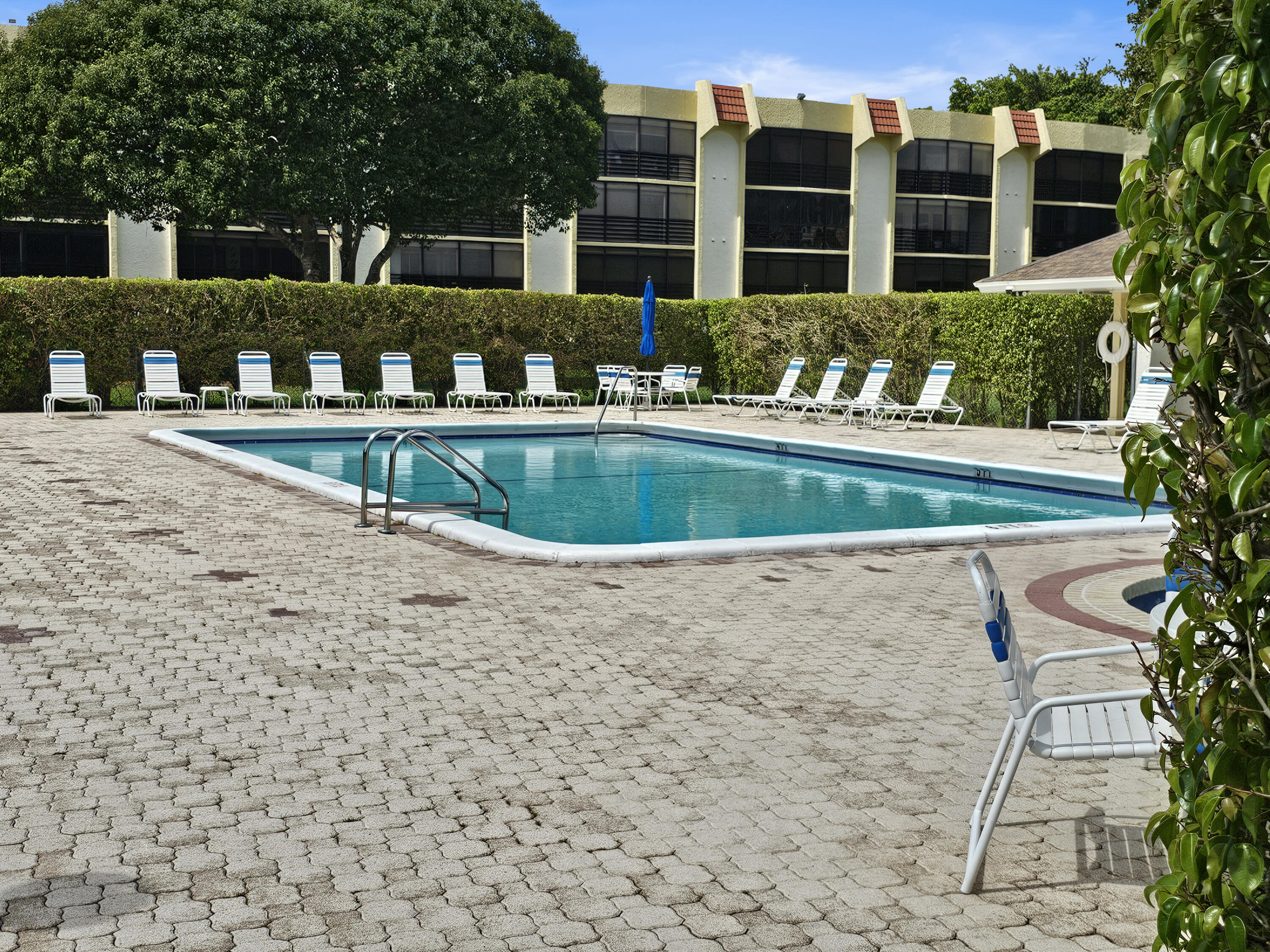23385 South Barwood Lane, Unit 1203 Boca Raton, FL 33428 - Photo 20 of 22 a front view of residential houses with yard