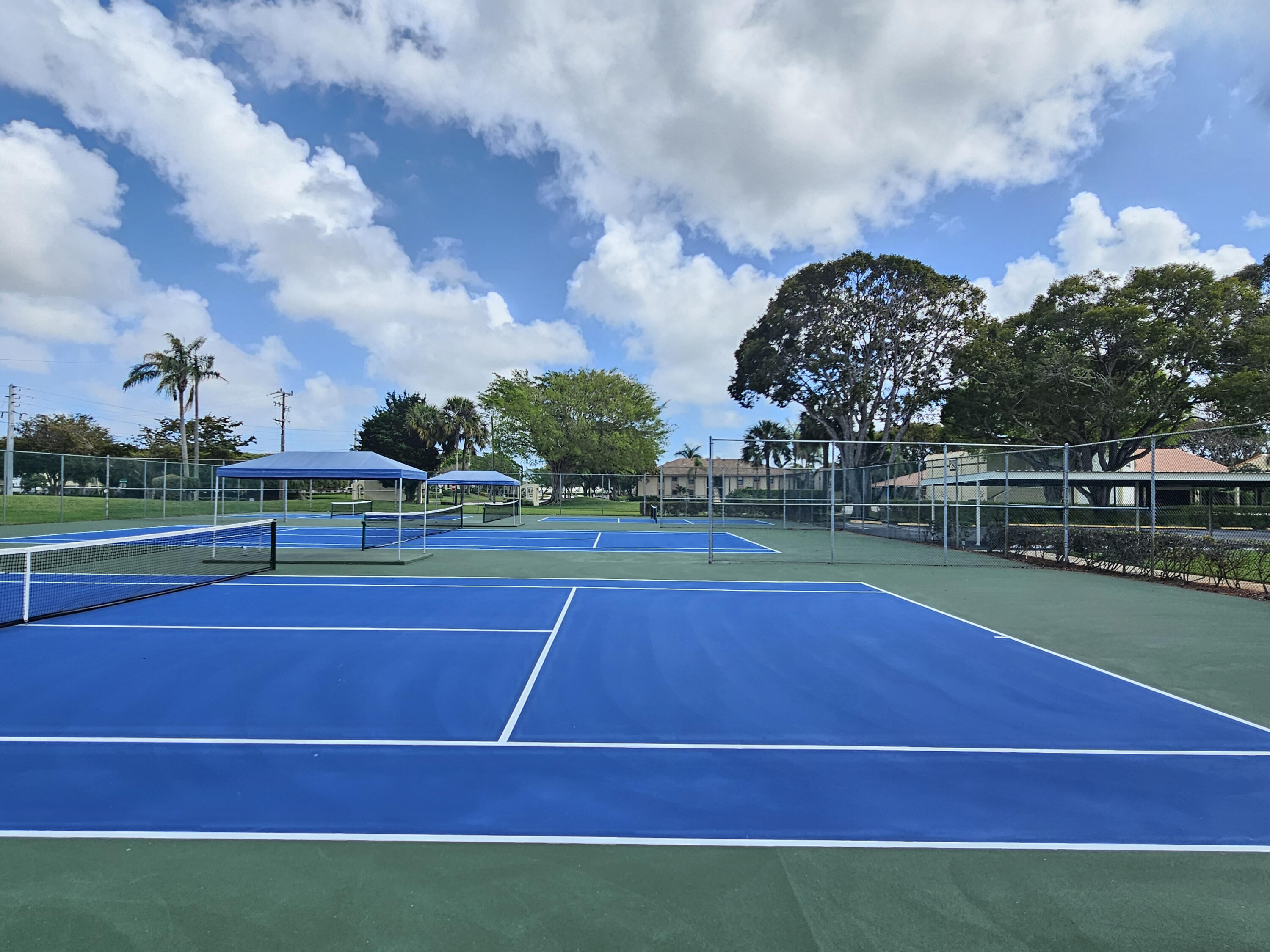 23385 South Barwood Lane, Unit 1203 Boca Raton, FL 33428 - Photo 21 of 22 a view of a tennis court