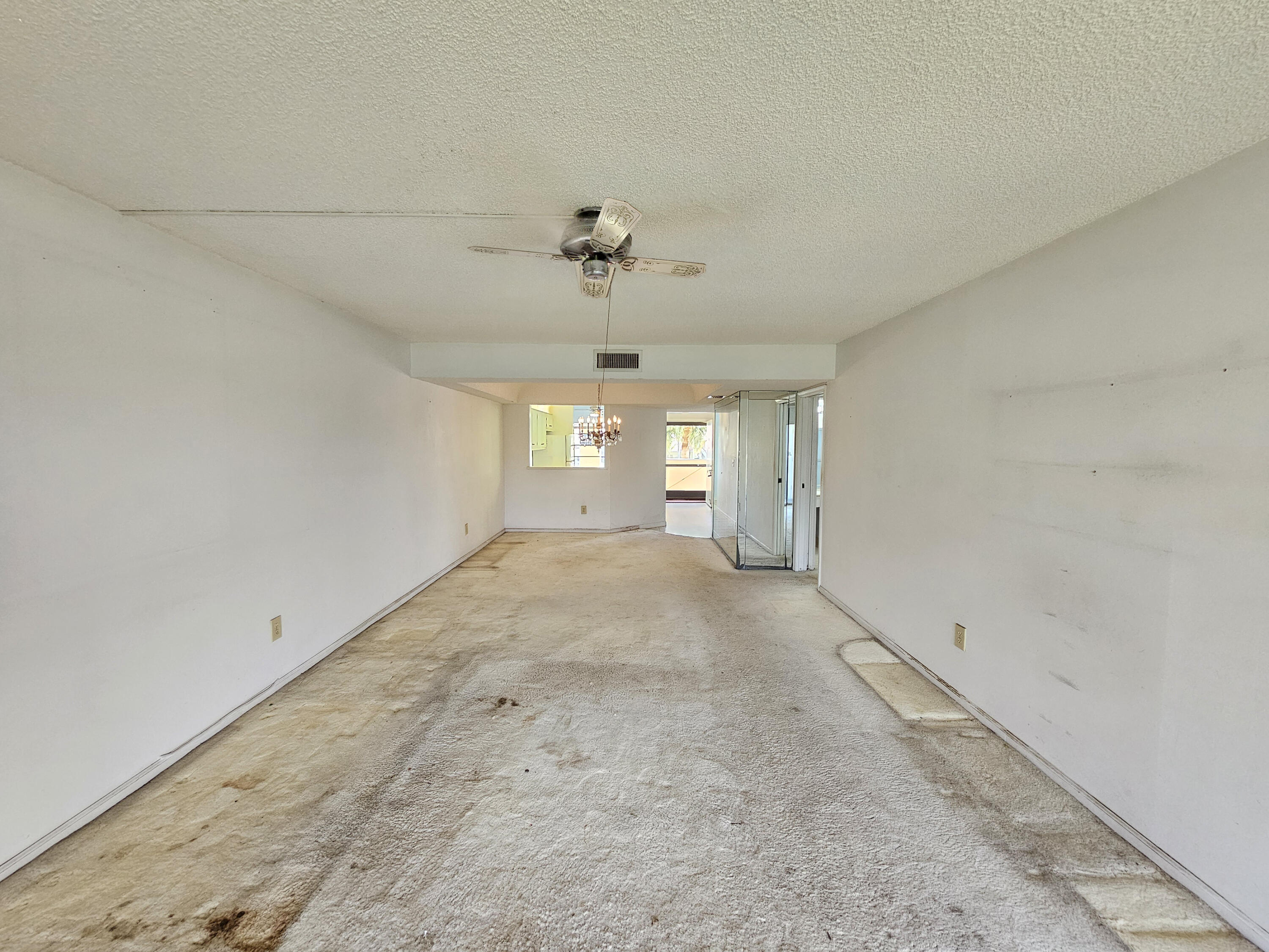 23385 South Barwood Lane, Unit 1203 Boca Raton, FL 33428 - Photo 5 of 22 an empty room with windows and entrance