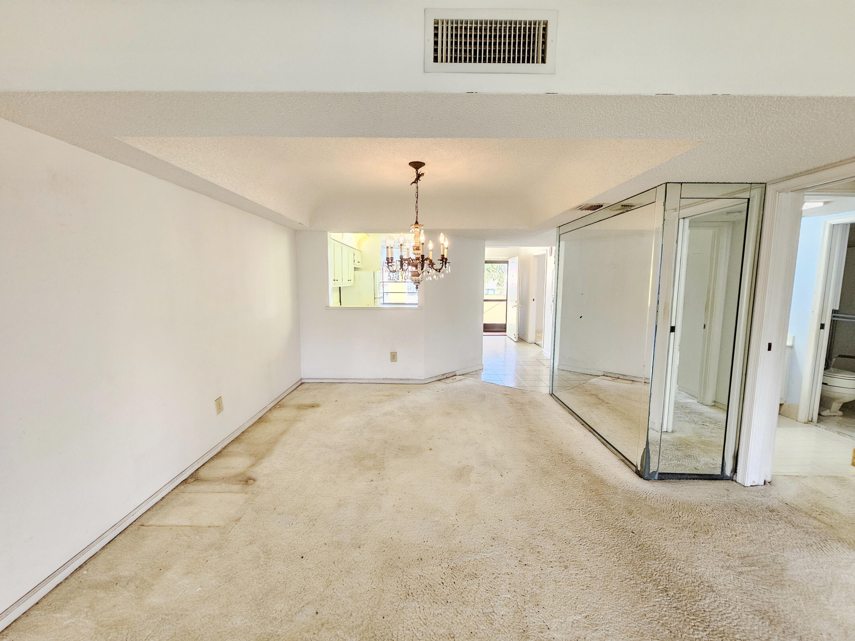 23385 South Barwood Lane, Unit 1203 Boca Raton, FL 33428 - Photo 6 of 22 en empty room with windows and entrance