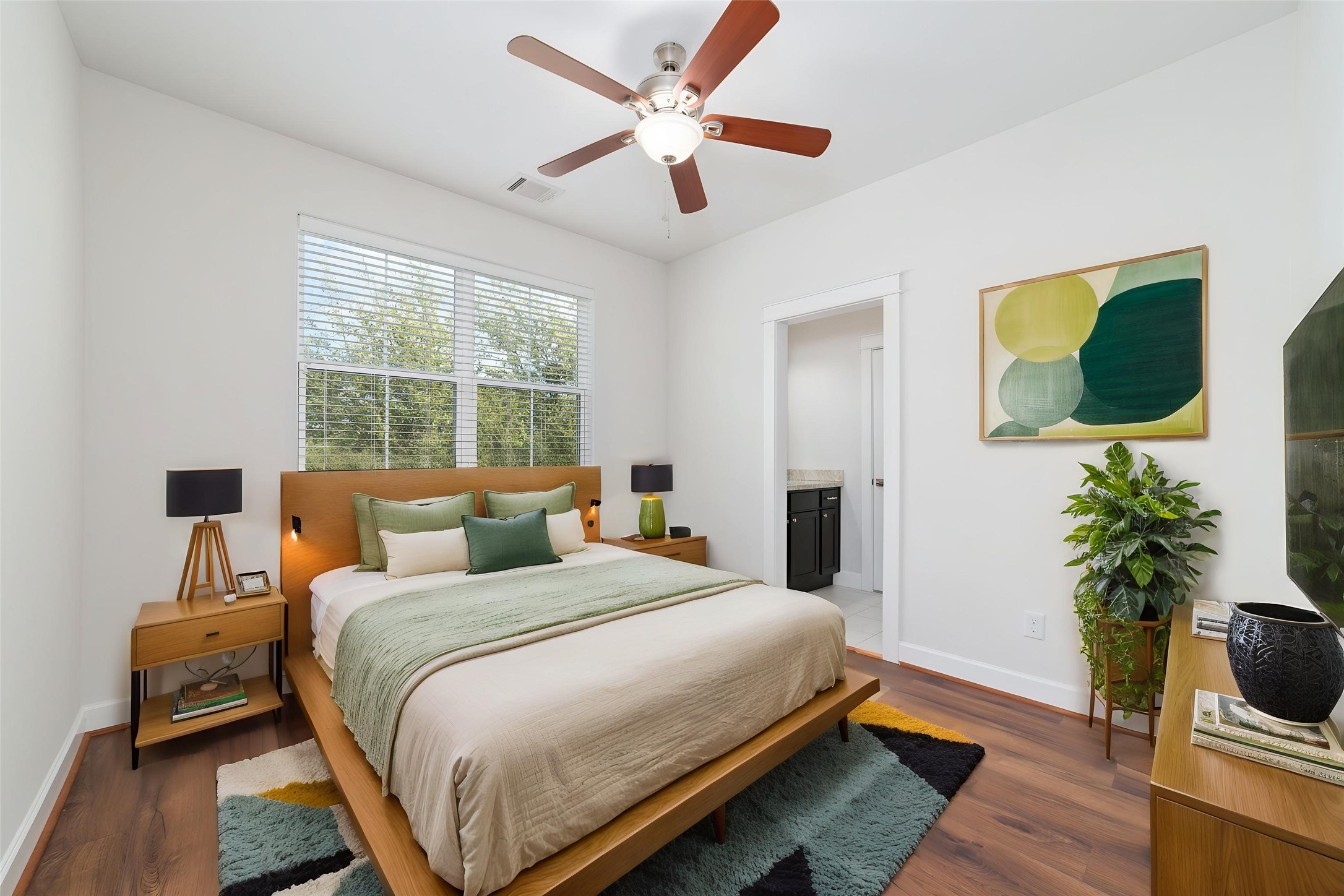 902 West 20th Street, Unit A Houston, TX 77008 - Photo 14 of 23 a bedroom with a bed and a potted plant