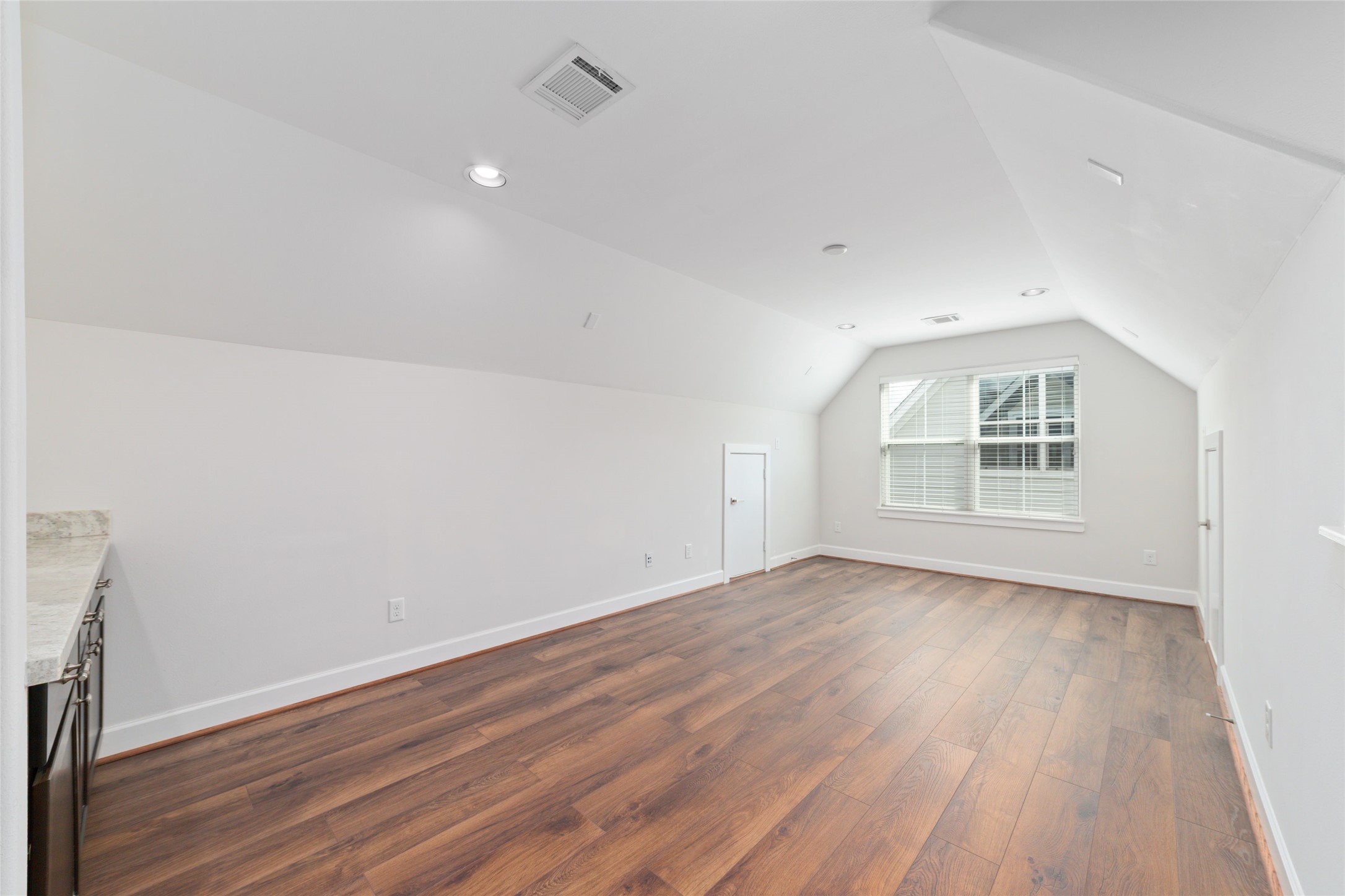 902 West 20th Street, Unit A Houston, TX 77008 - Photo 20 of 23 an empty room with wooden floor and windows