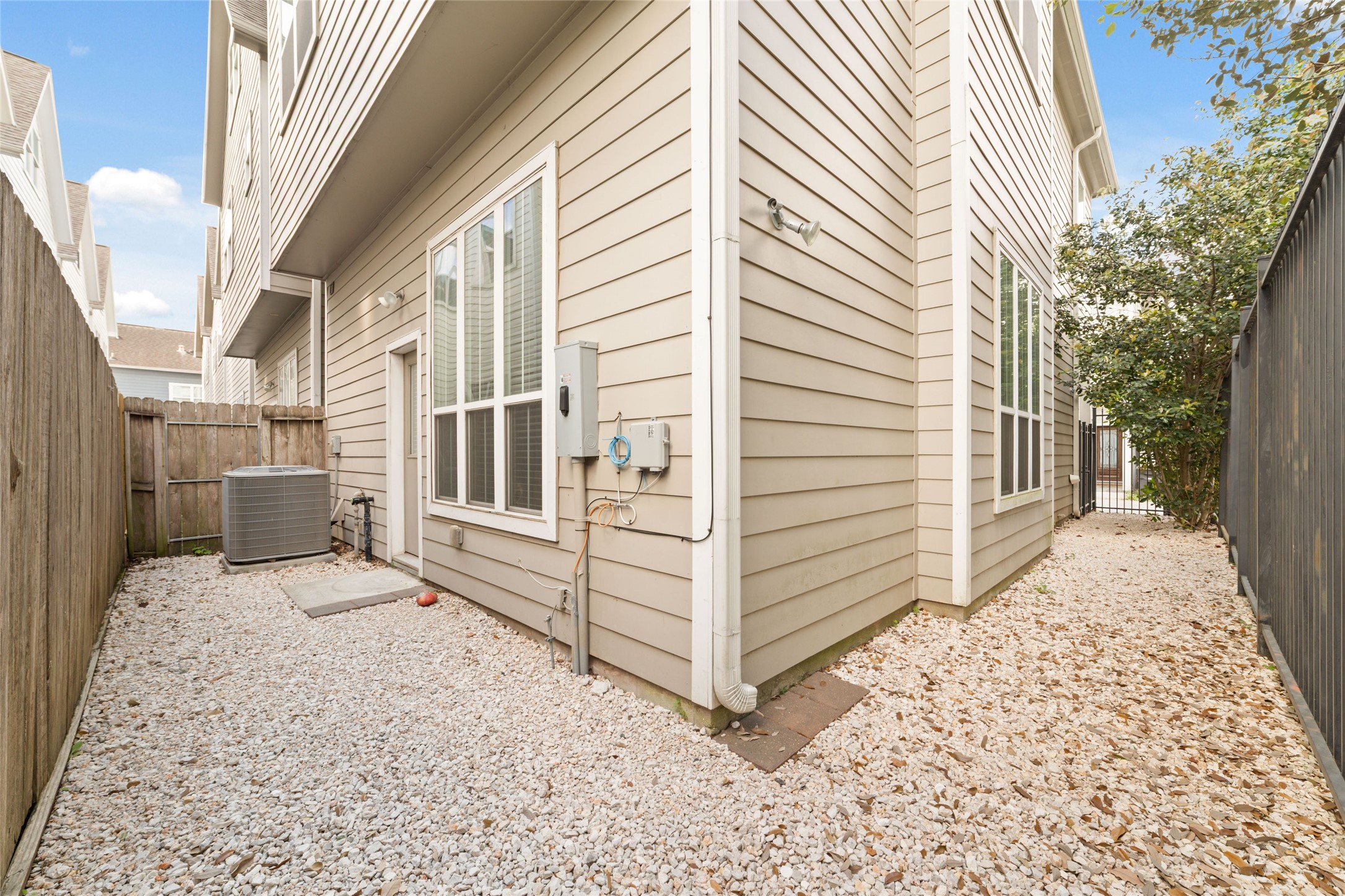 902 West 20th Street, Unit A Houston, TX 77008 - Photo 23 of 23 a view of a house with a door and wooden walls
