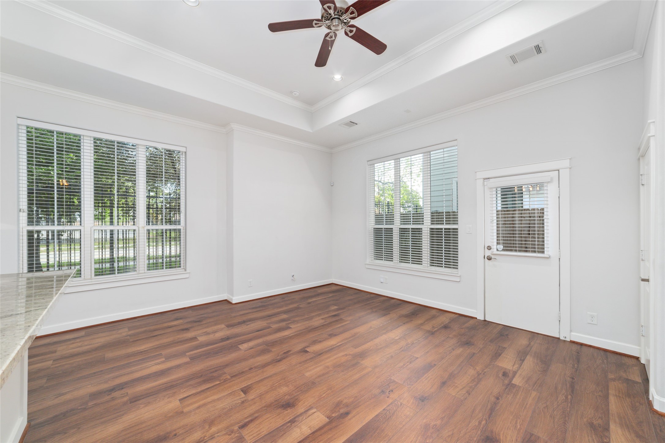 902 West 20th Street, Unit A Houston, TX 77008 - Photo 6 of 23 a view of empty room with wooden floor and fan