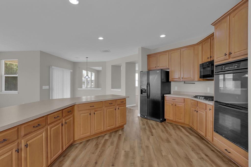 1978 Cutleaf Creek Road Southeast Grayson, GA 30017 - Photo 17 of 38 a kitchen with stainless steel appliances granite countertop a refrigerator sink and cabinets