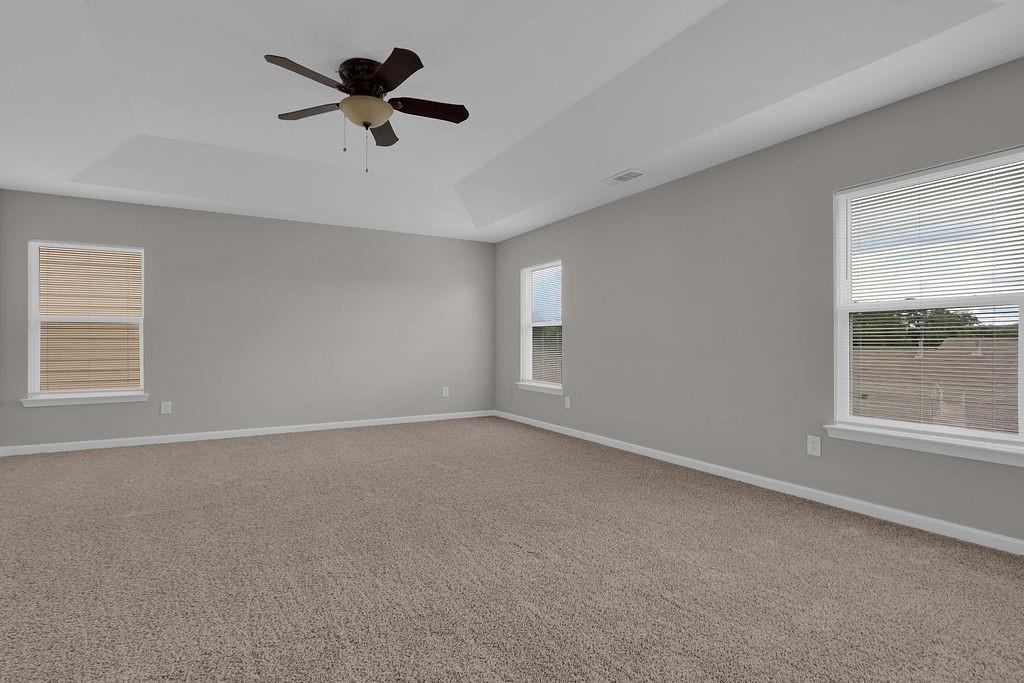 1978 Cutleaf Creek Road Southeast Grayson, GA 30017 - Photo 29 of 38 an empty room with a window and a ceiling fan