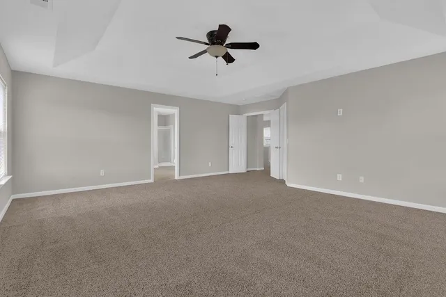 a view of room with ceiling fan