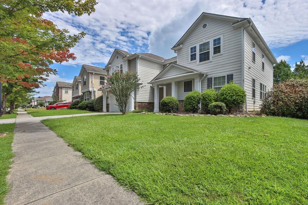 1978 Cutleaf Creek Road Southeast Grayson, GA 30017 - Photo 3 of 38 a front view of a house with a yard