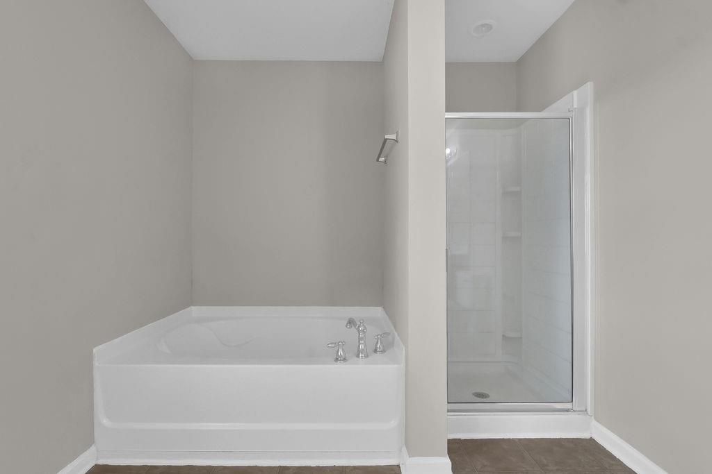 1978 Cutleaf Creek Road Southeast Grayson, GA 30017 - Photo 35 of 38 a bathroom with a bathtub