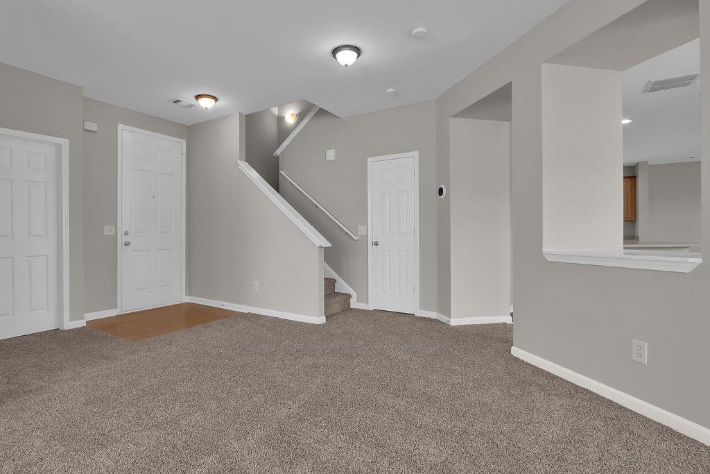 1978 Cutleaf Creek Road Southeast Grayson, GA 30017 - Photo 8 of 38 a view of an empty room with wooden floor