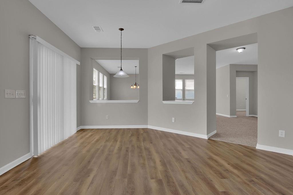 1978 Cutleaf Creek Road Southeast Grayson, GA 30017 - Photo 9 of 38 a view of an empty room with wooden floor and a window