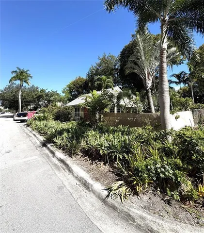 a view of street with flower plants