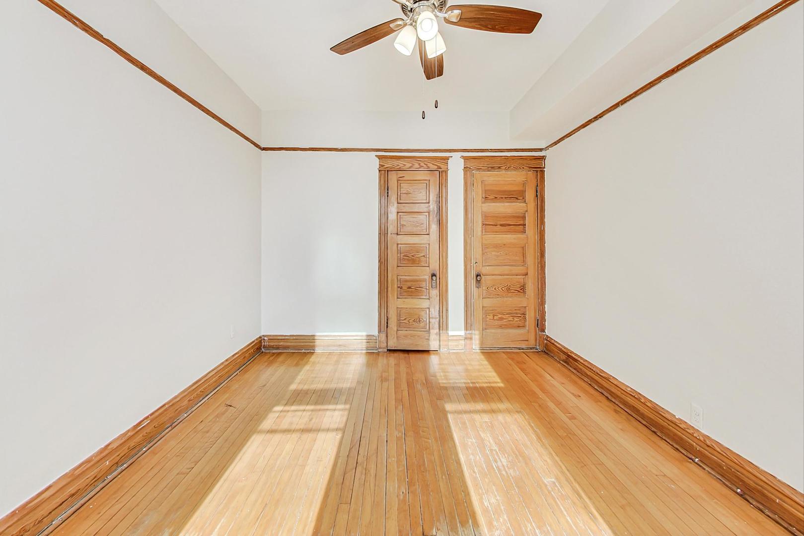 1646 West Byron Street, Unit 3F Chicago, IL 60613 - Photo 17 of 30 a view of an empty room with wooden floor