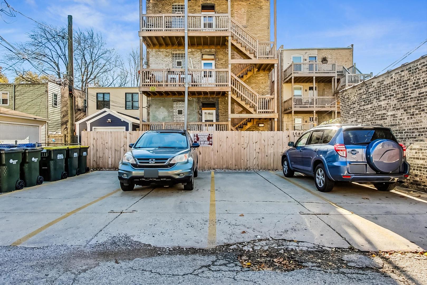 1646 West Byron Street, Unit 3F Chicago, IL 60613 - Photo 30 of 30 a car parked in front of a building
