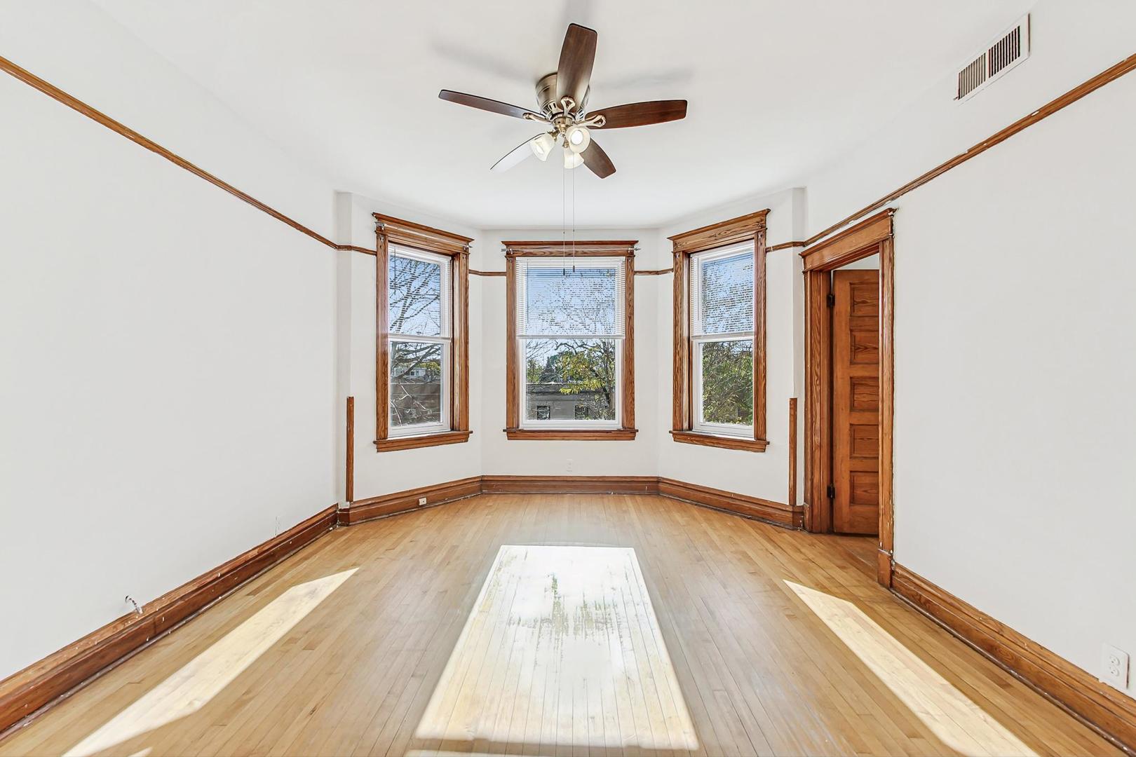 1646 West Byron Street, Unit 3F Chicago, IL 60613 - Photo 6 of 30 a view of room with a ceiling fan and window