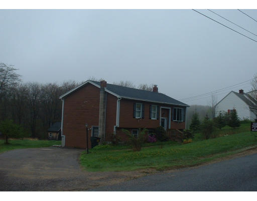 13 G French Road Charlton, MA 01507 - Photo 1 of 1 a view of a house with yard and a wooden fence