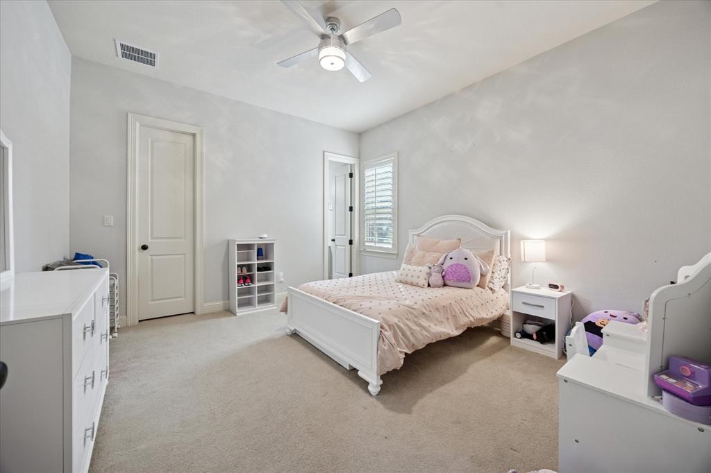 580 Butchart Drive Prosper, TX 75078 - Photo 26 of 40 Bedroom with light carpet and a ceiling fan