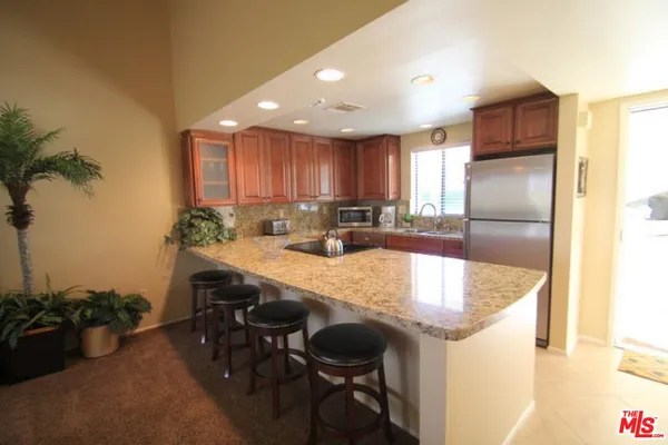 a kitchen with a table and chairs in it