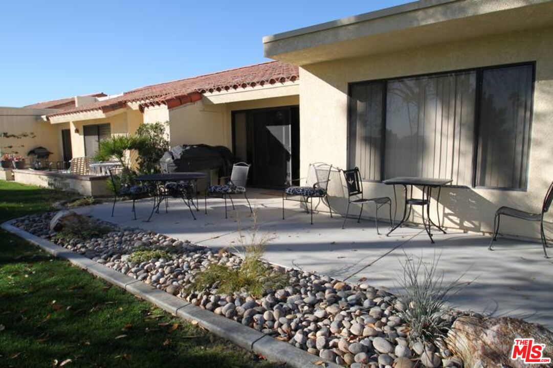 40420 Bay Hill Way Palm Desert, CA 92211 - Photo 8 of 12 a front view of a house with garden