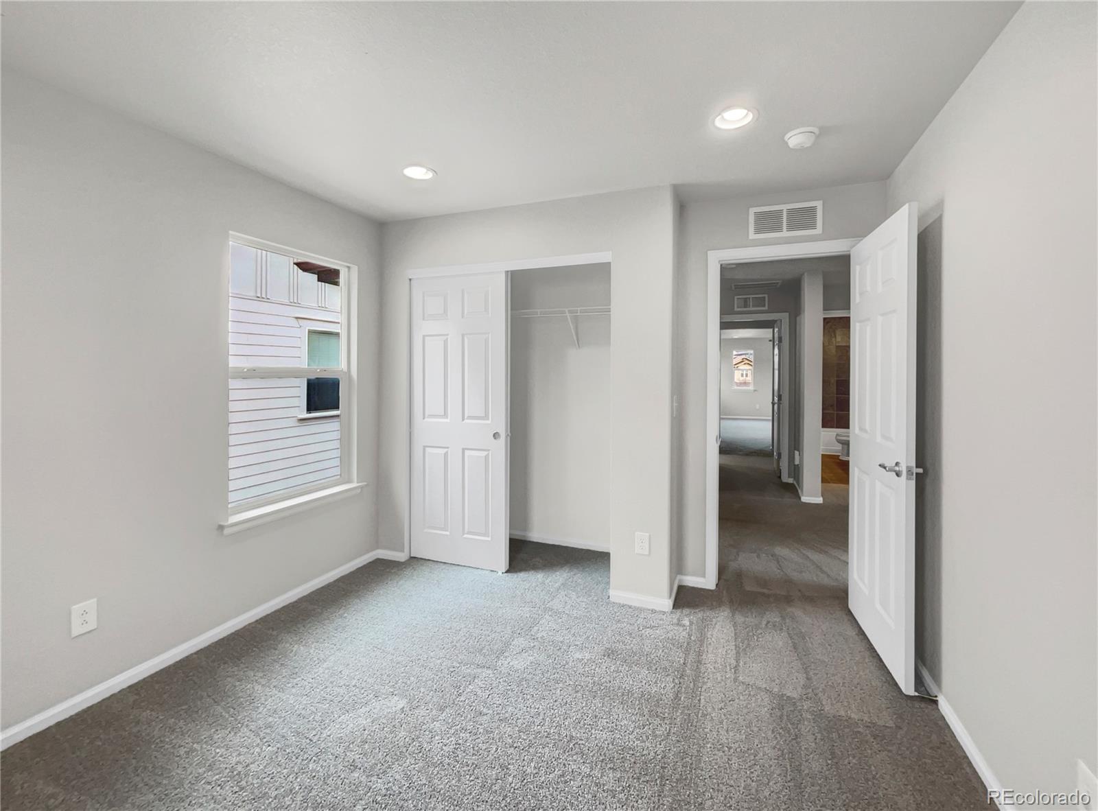 2380 Xanthia Way Denver, CO 80238 - Photo 11 of 19 a view of livingroom with a hallway