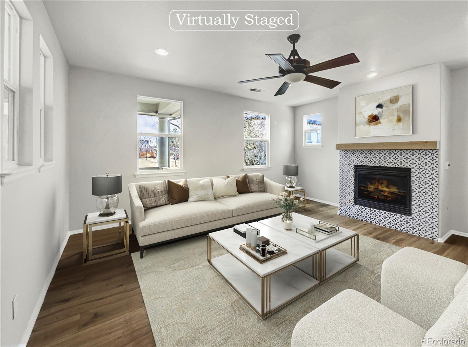 2380 Xanthia Way Denver, CO 80238 - Photo 2 of 19 a living room with furniture a fireplace and a window