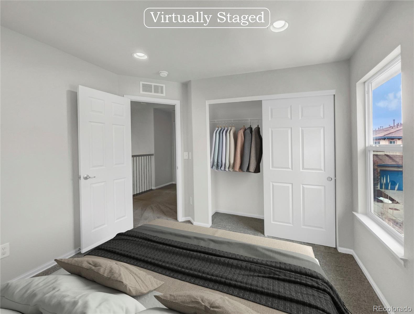 2380 Xanthia Way Denver, CO 80238 - Photo 4 of 19 a bedroom with a bed and closet