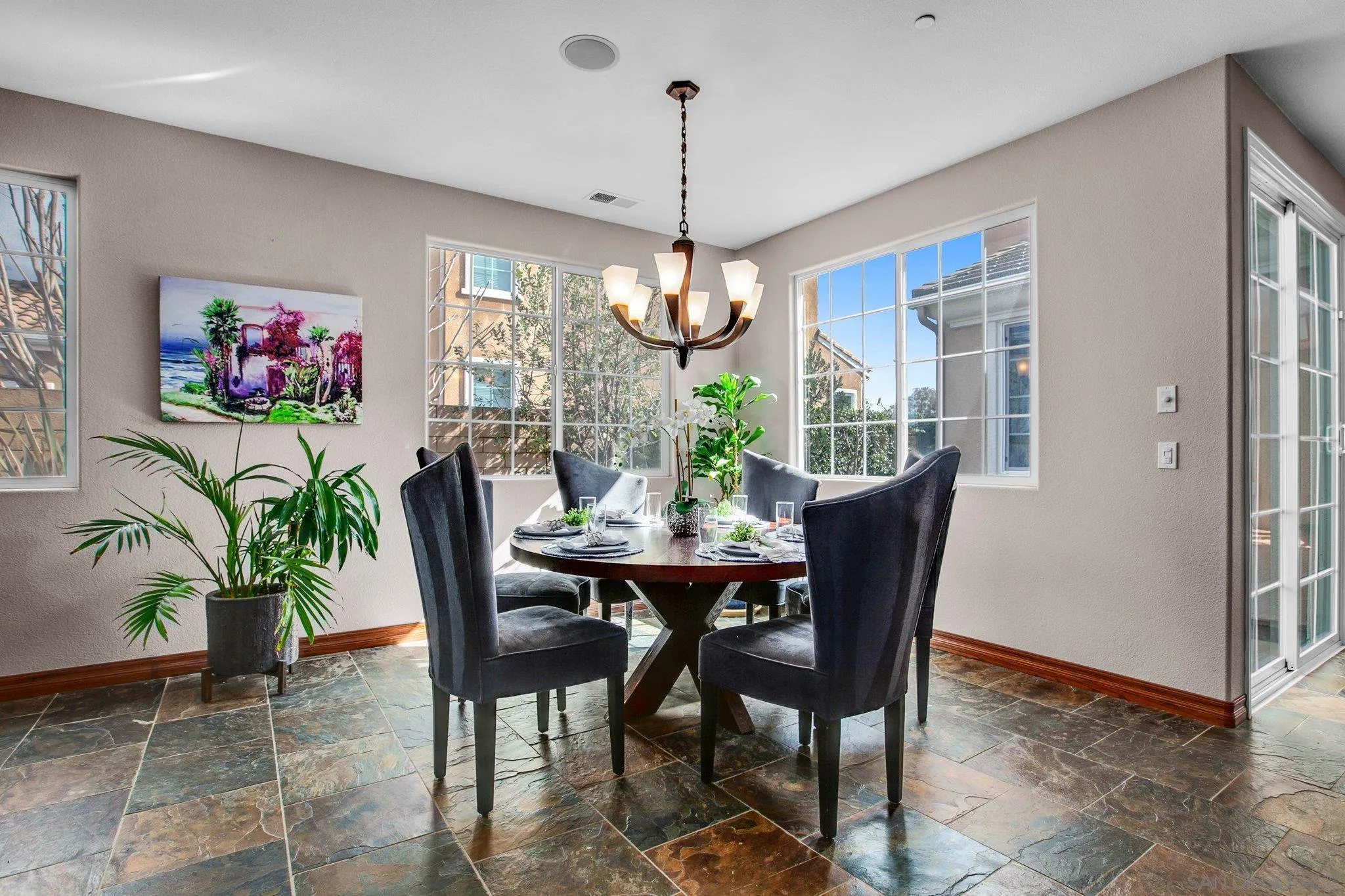 1104 Sagewood Drive Oceanside, CA 92056 - Photo 14 of 46 a dining room with furniture a chandelier and window