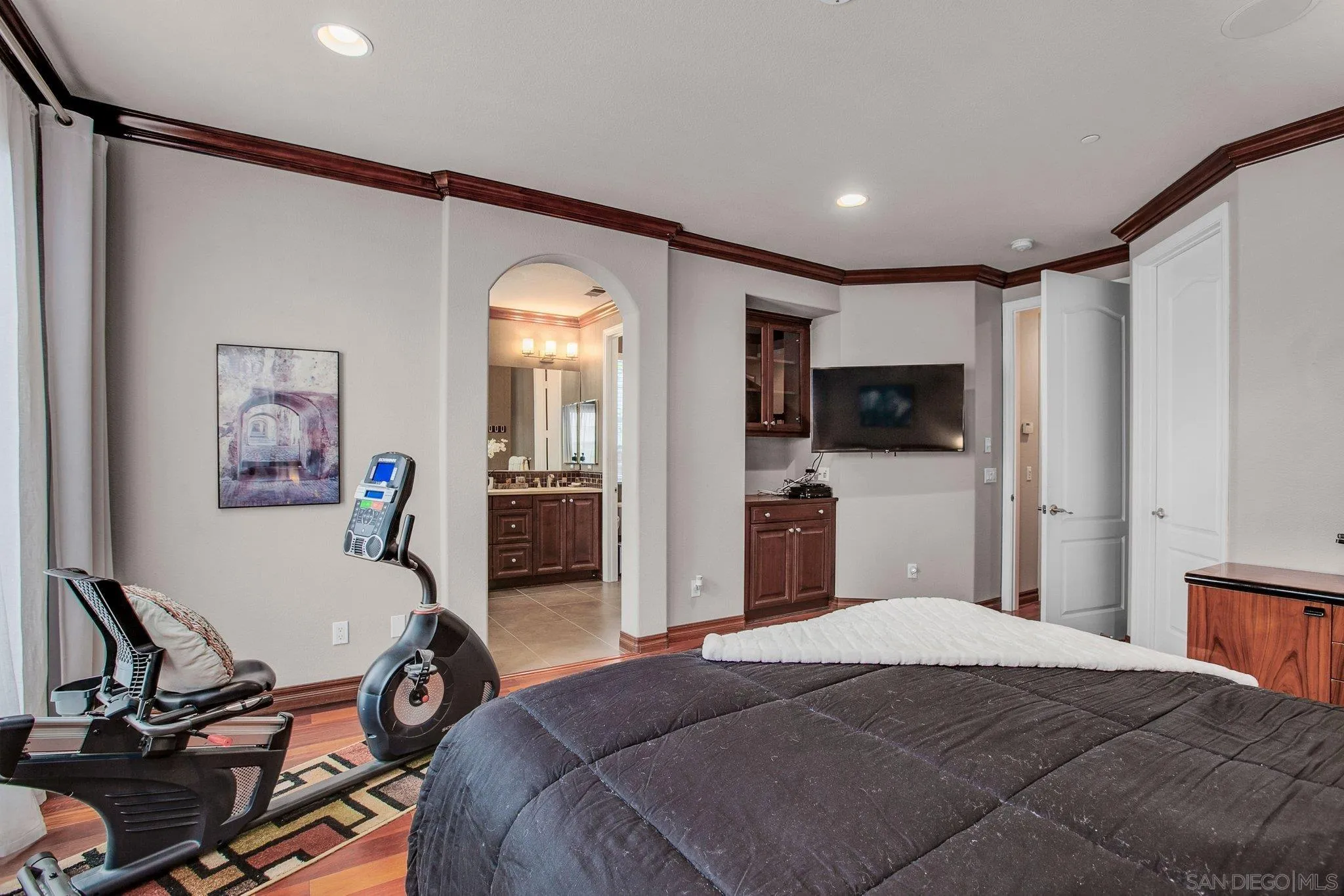 1104 Sagewood Drive Oceanside, CA 92056 - Photo 23 of 46 a bedroom with a bed mirror and a desk