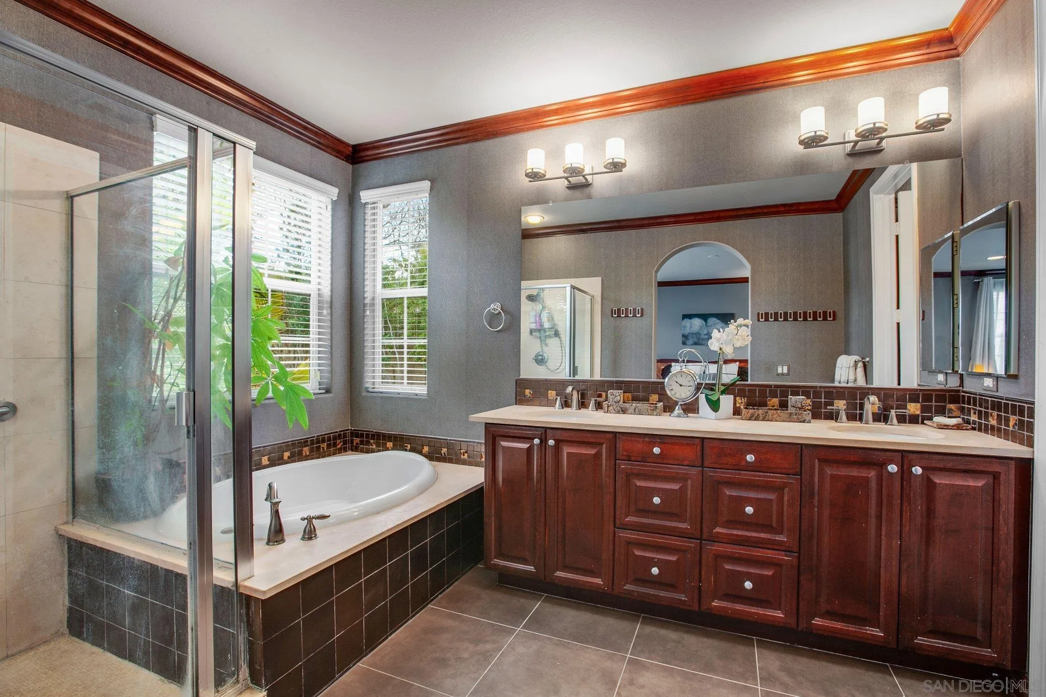 1104 Sagewood Drive Oceanside, CA 92056 - Photo 24 of 46 a spacious bathroom with a tub sink and mirror