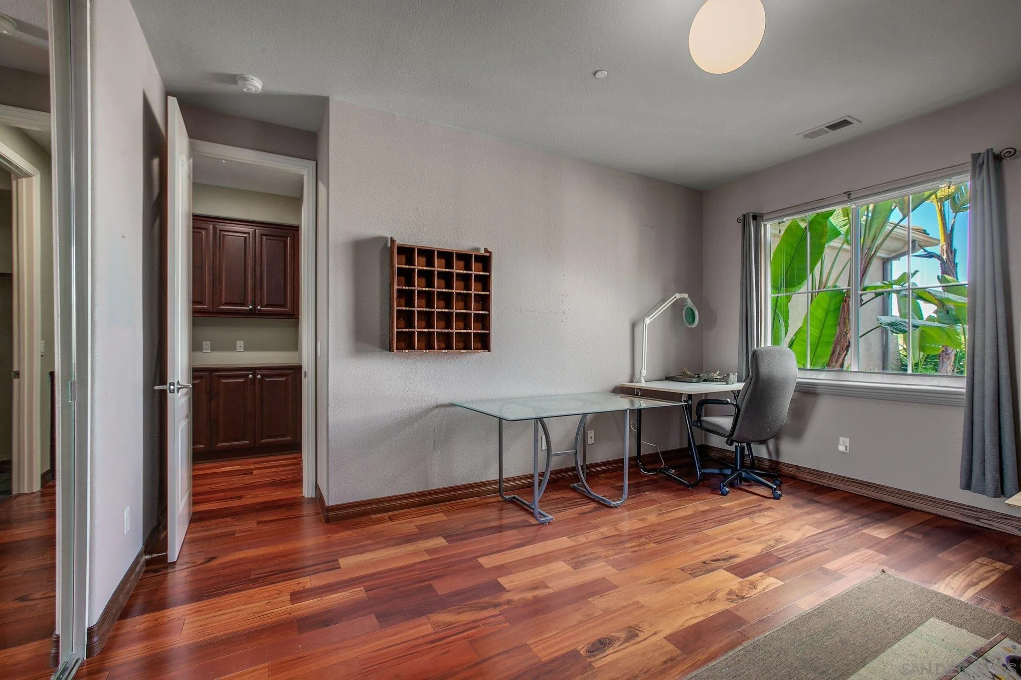 1104 Sagewood Drive Oceanside, CA 92056 - Photo 25 of 46 a workspace with furniture window and wooden floor