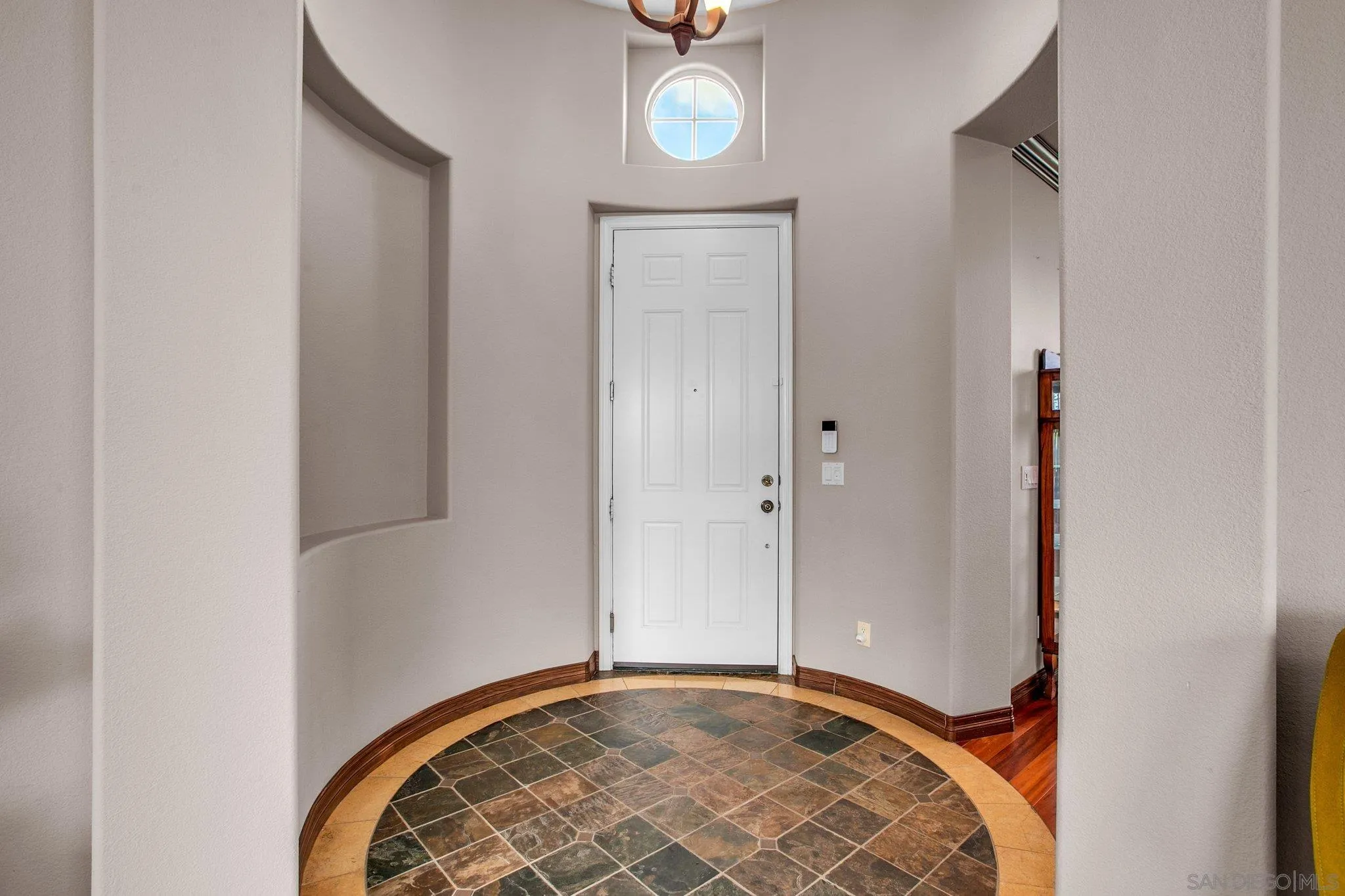 1104 Sagewood Drive Oceanside, CA 92056 - Photo 4 of 46 a view of an empty room with wooden floor and a window