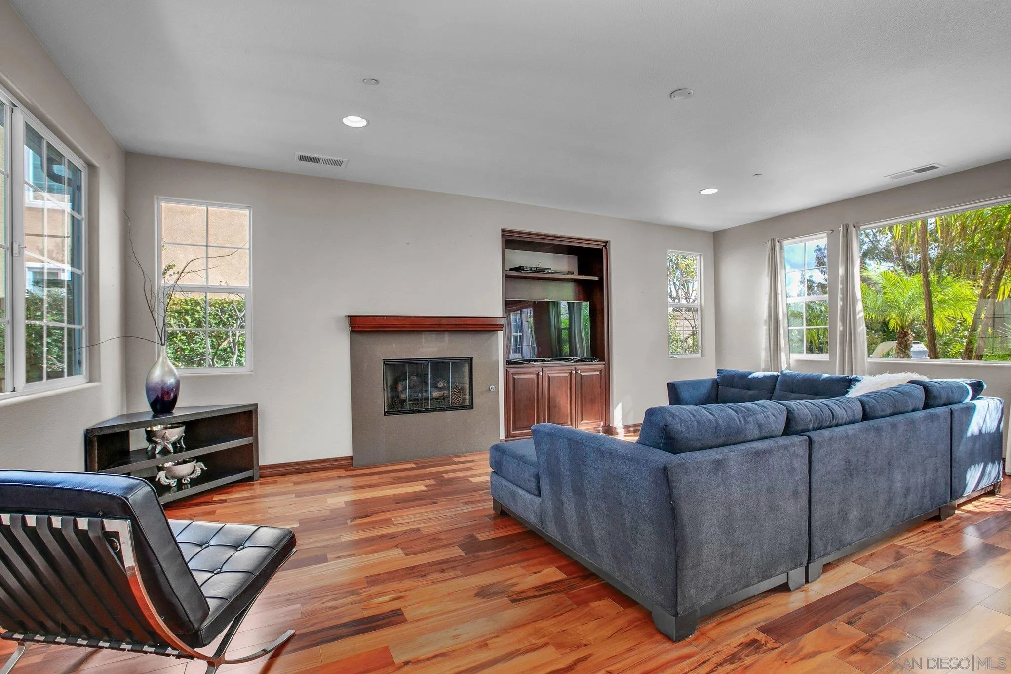 1104 Sagewood Drive Oceanside, CA 92056 - Photo 9 of 46 a living room with furniture and a fireplace