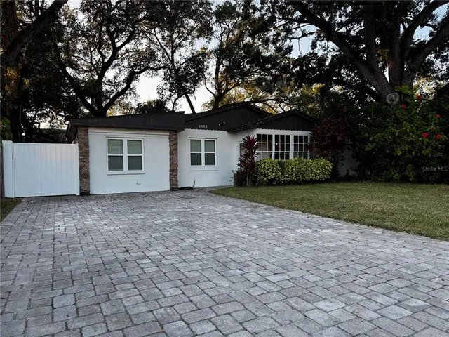 a front view of house with yard and green space