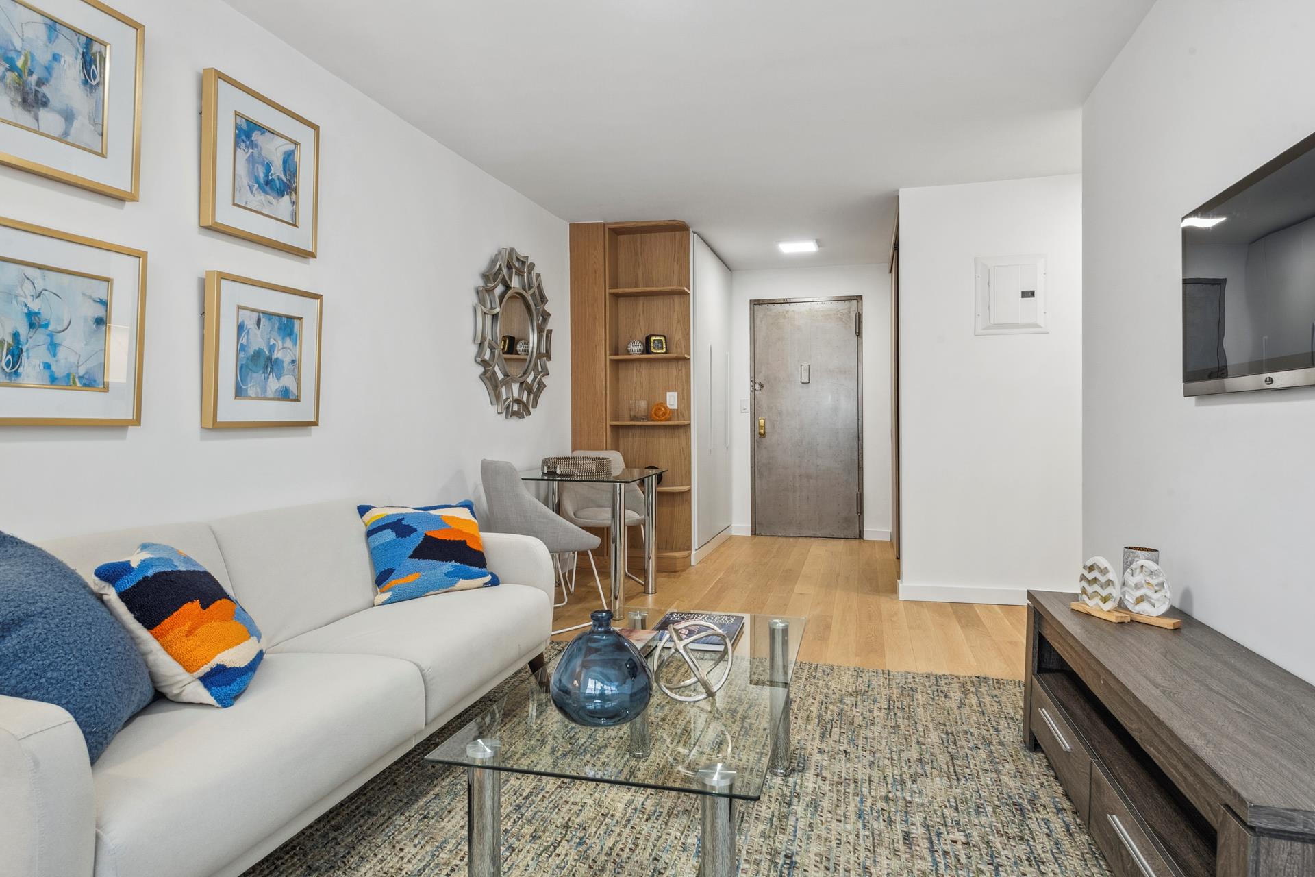 a living room with furniture and flat screen tv